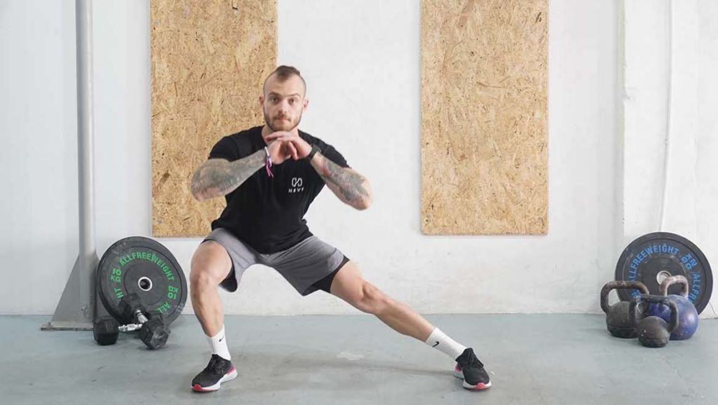 man lateral squat bodyweight inner thigh workout