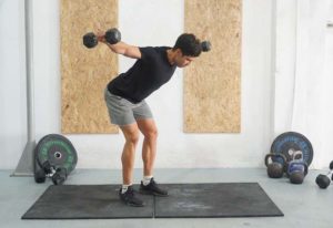man bent over fly dumbbell