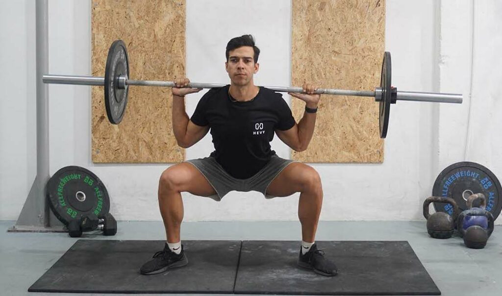 man sumo squat barbell glute compound exercises