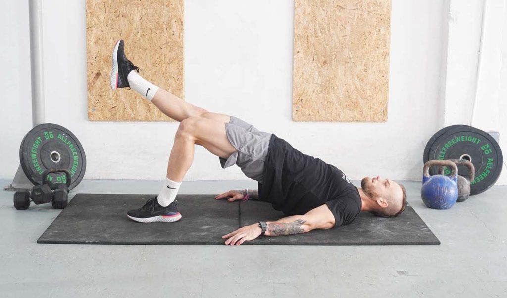 man single leg glute bridge upper glute workout