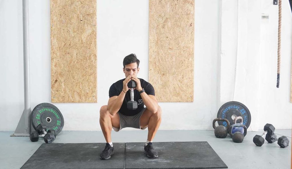 man goblet squat dumbbell 